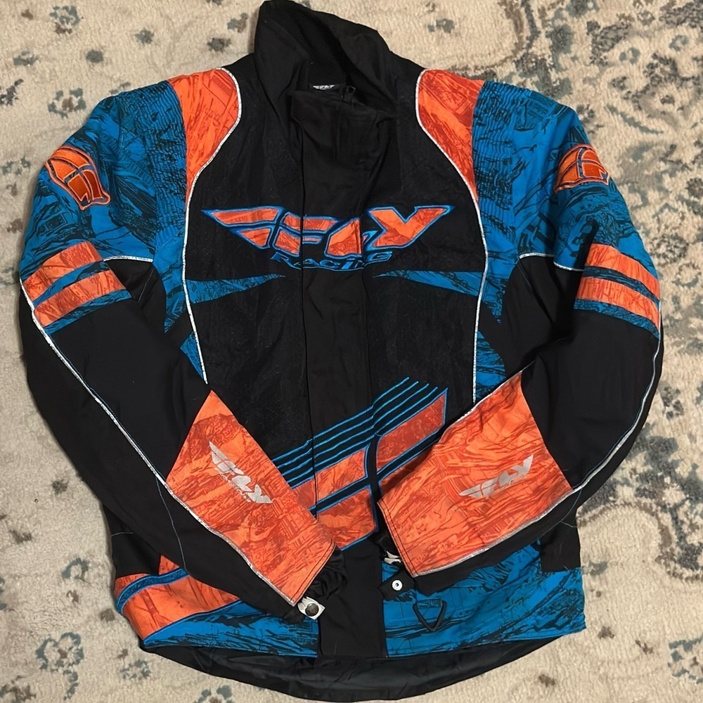 Black, orange, and blue 
Brand: FLY Racing jacket